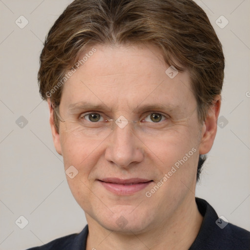 Joyful white adult male with short  brown hair and grey eyes