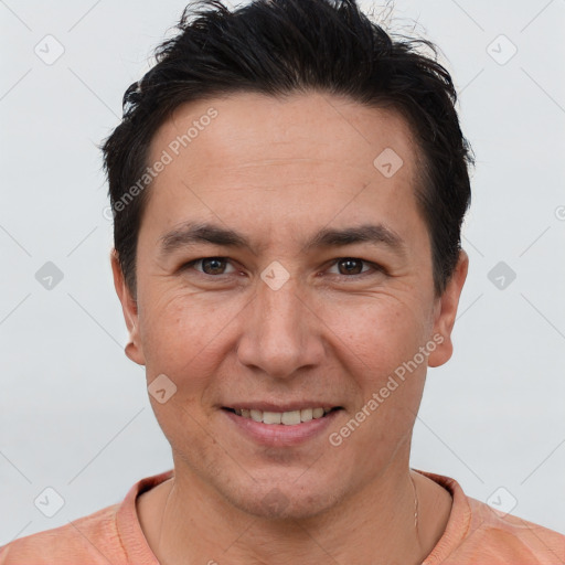 Joyful white adult male with short  brown hair and brown eyes