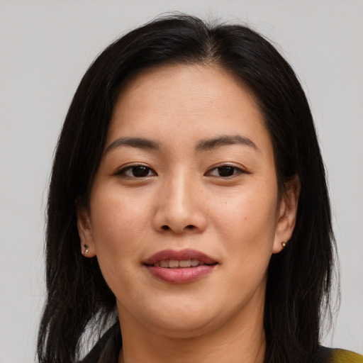 Joyful asian young-adult female with medium  brown hair and brown eyes