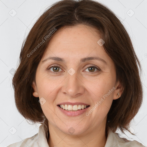 Joyful white adult female with medium  brown hair and grey eyes