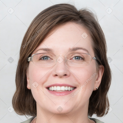 Joyful white adult female with medium  brown hair and grey eyes