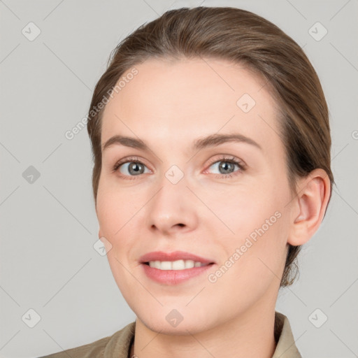 Joyful white young-adult female with medium  brown hair and grey eyes