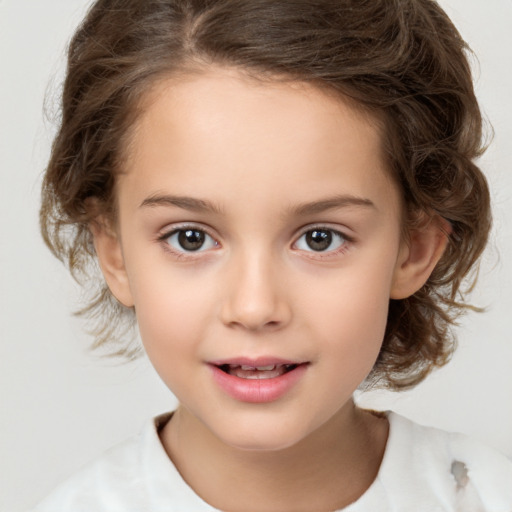 Joyful white child female with medium  brown hair and brown eyes