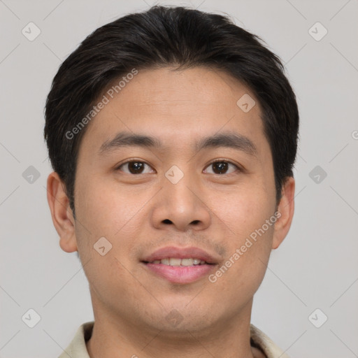 Joyful asian young-adult male with short  brown hair and brown eyes