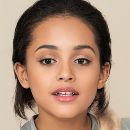 Joyful latino young-adult female with long  brown hair and brown eyes