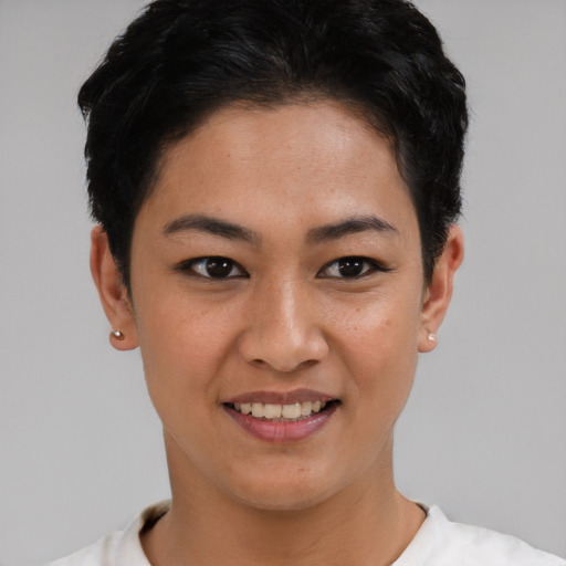 Joyful asian young-adult female with short  brown hair and brown eyes