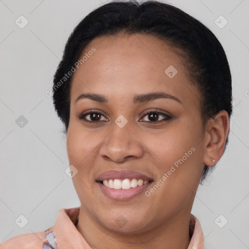 Joyful latino young-adult female with short  black hair and brown eyes