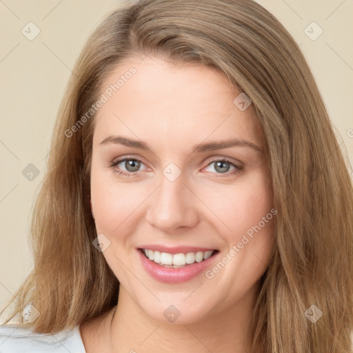 Joyful white young-adult female with long  brown hair and green eyes