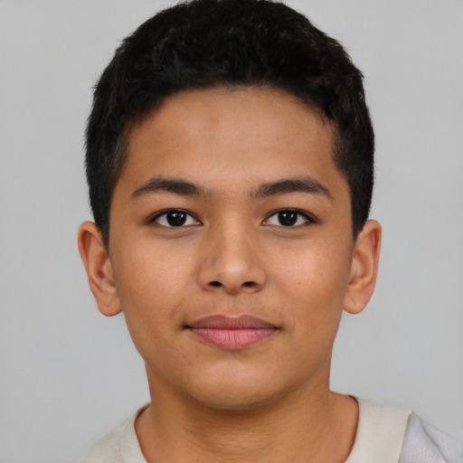 Joyful asian child male with short  black hair and brown eyes