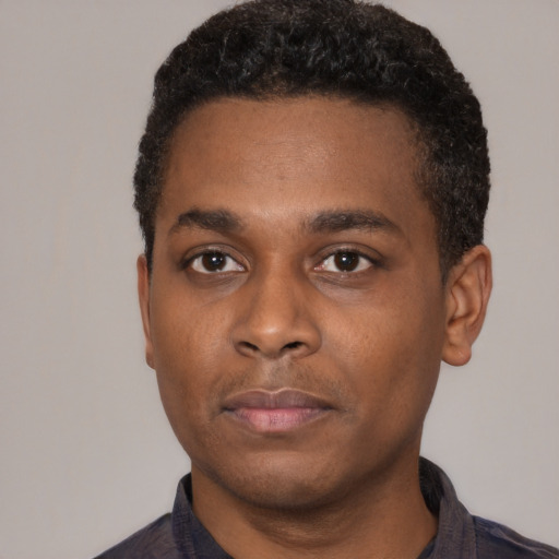 Neutral black young-adult male with short  black hair and brown eyes