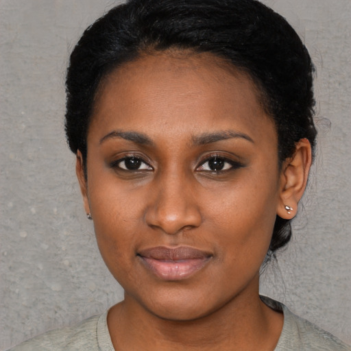 Neutral black young-adult female with short  black hair and brown eyes