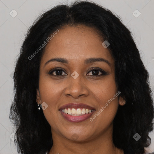 Joyful black young-adult female with long  brown hair and brown eyes