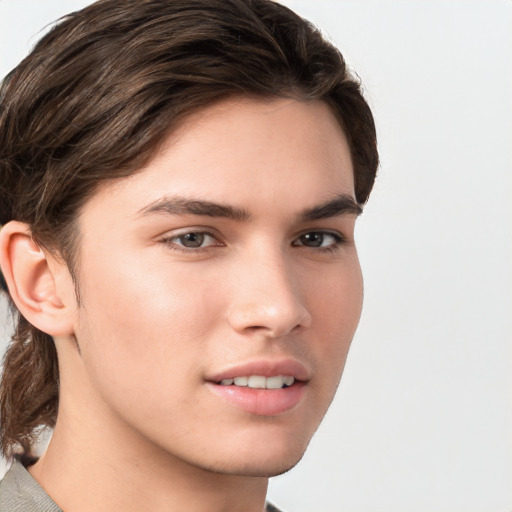 Joyful white young-adult male with medium  brown hair and brown eyes