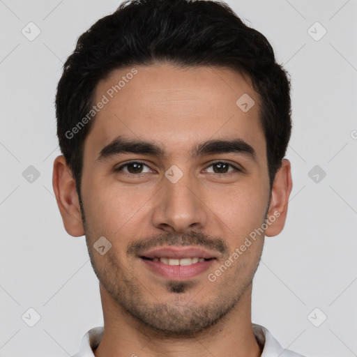 Joyful white young-adult male with short  black hair and brown eyes