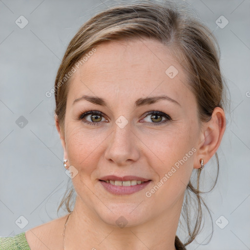 Joyful white young-adult female with medium  brown hair and blue eyes