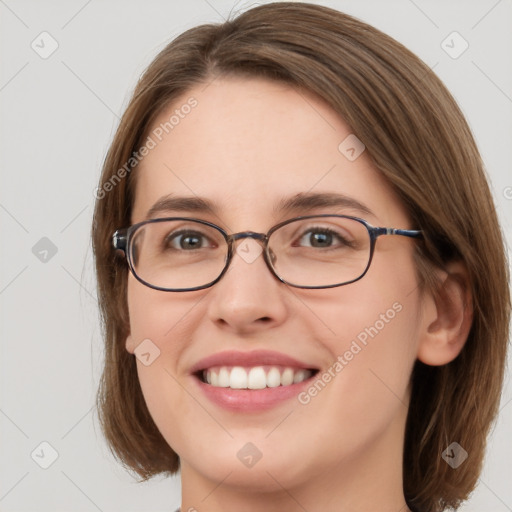 Joyful white young-adult female with medium  brown hair and green eyes