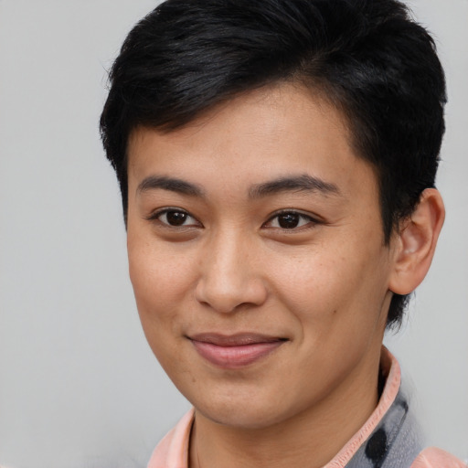 Joyful asian young-adult female with short  brown hair and brown eyes