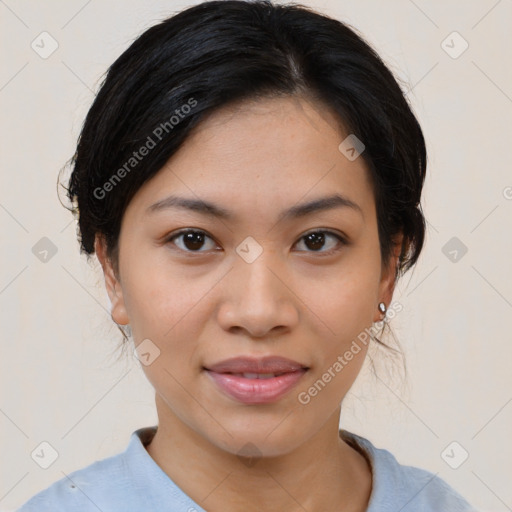 Joyful latino young-adult female with medium  brown hair and brown eyes