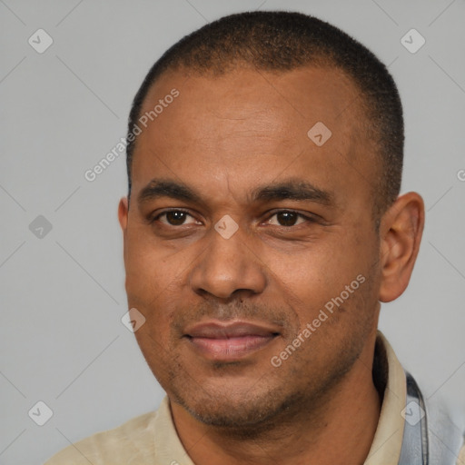Joyful latino adult male with short  brown hair and brown eyes