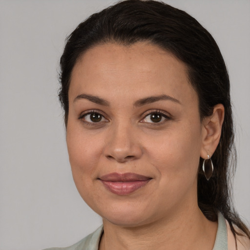 Joyful white young-adult female with medium  brown hair and brown eyes