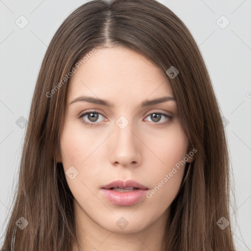 Neutral white young-adult female with long  brown hair and brown eyes