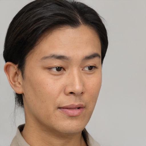 Neutral asian young-adult male with short  brown hair and brown eyes