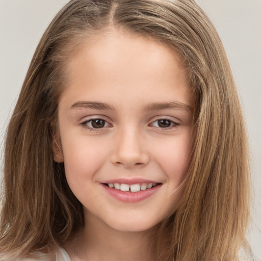 Joyful white child female with long  brown hair and brown eyes