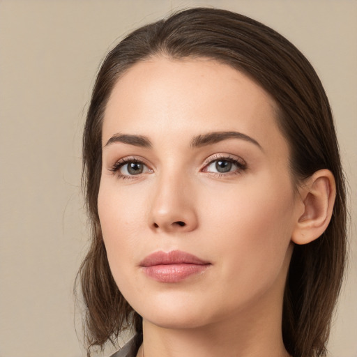 Neutral white young-adult female with long  brown hair and brown eyes