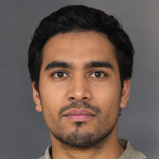 Neutral latino young-adult male with short  black hair and brown eyes