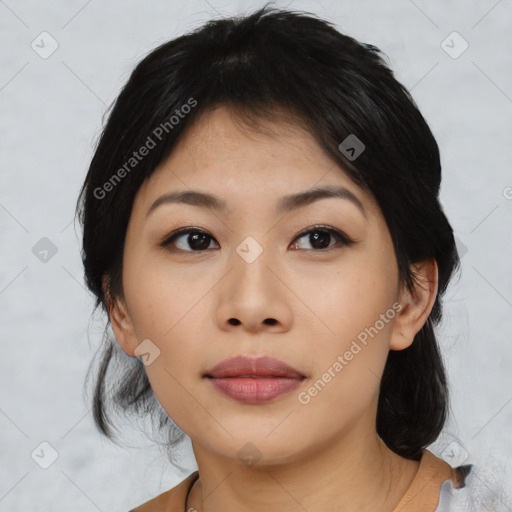 Joyful asian young-adult female with medium  black hair and brown eyes