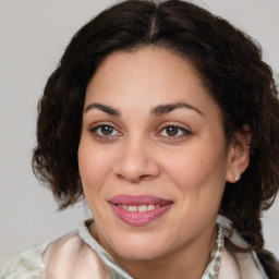 Joyful white adult female with medium  brown hair and brown eyes