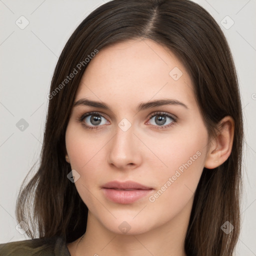 Neutral white young-adult female with long  brown hair and brown eyes