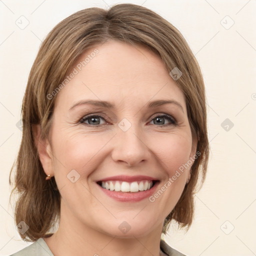 Joyful white young-adult female with medium  brown hair and green eyes