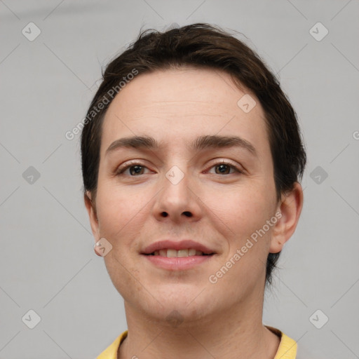 Joyful white young-adult female with short  brown hair and brown eyes