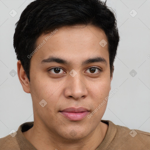 Joyful latino young-adult male with short  brown hair and brown eyes