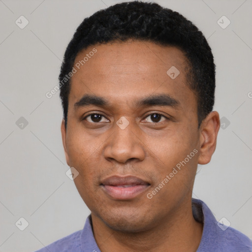 Joyful black young-adult male with short  black hair and brown eyes