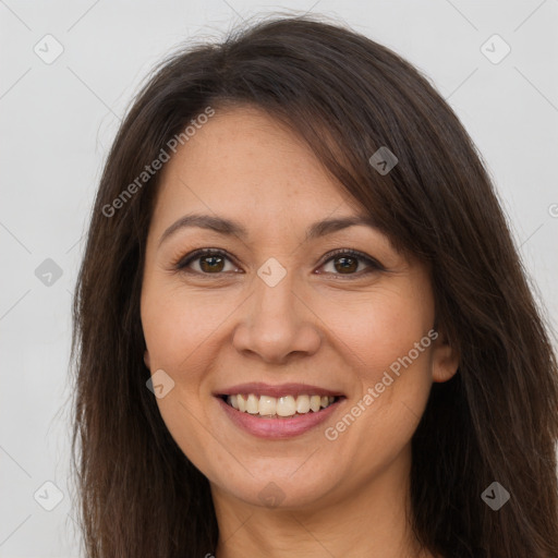 Joyful white adult female with long  brown hair and brown eyes