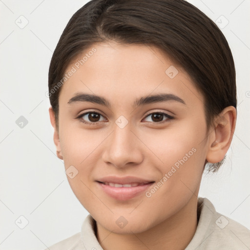 Joyful white young-adult female with short  brown hair and brown eyes