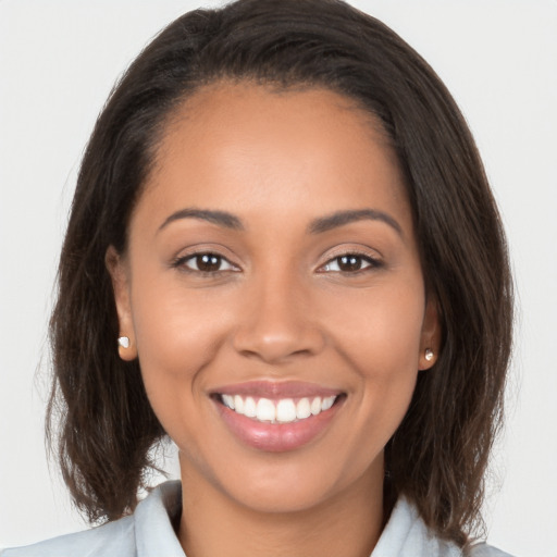 Joyful white young-adult female with medium  brown hair and brown eyes