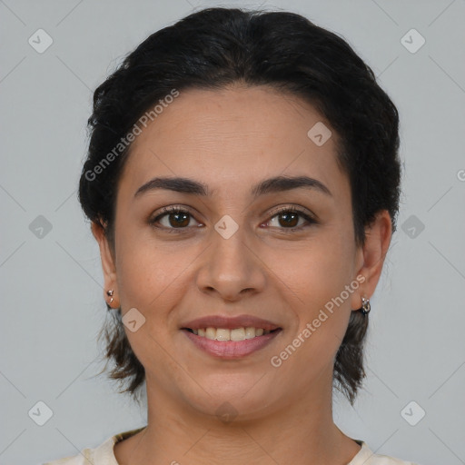 Joyful latino young-adult female with medium  brown hair and brown eyes