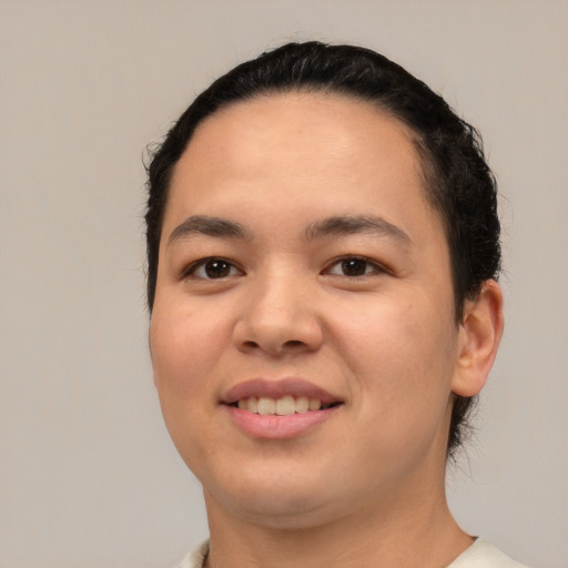 Joyful white young-adult female with short  black hair and brown eyes