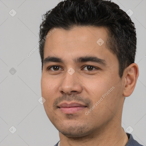 Joyful white young-adult male with short  black hair and brown eyes