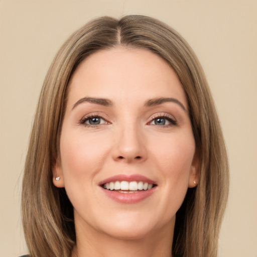 Joyful white young-adult female with long  brown hair and brown eyes