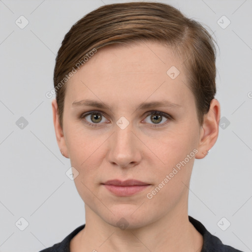 Joyful white young-adult female with short  brown hair and grey eyes