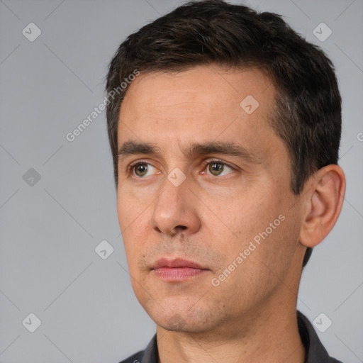 Neutral white adult male with short  black hair and brown eyes