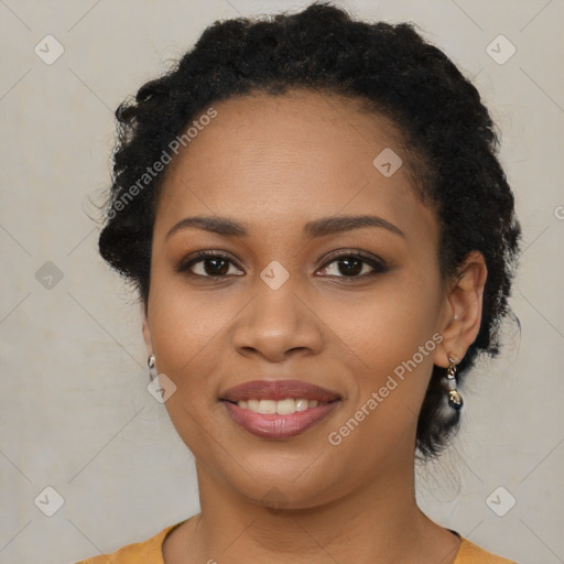 Joyful black young-adult female with medium  black hair and brown eyes