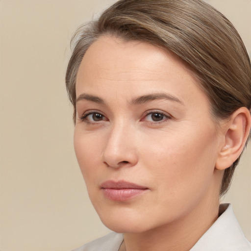 Neutral white young-adult female with medium  brown hair and brown eyes