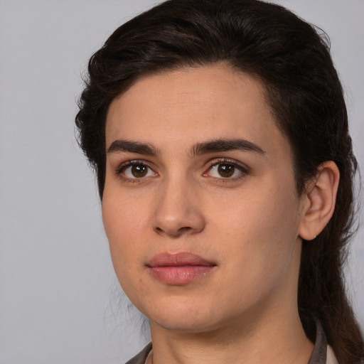 Joyful white young-adult female with medium  brown hair and brown eyes