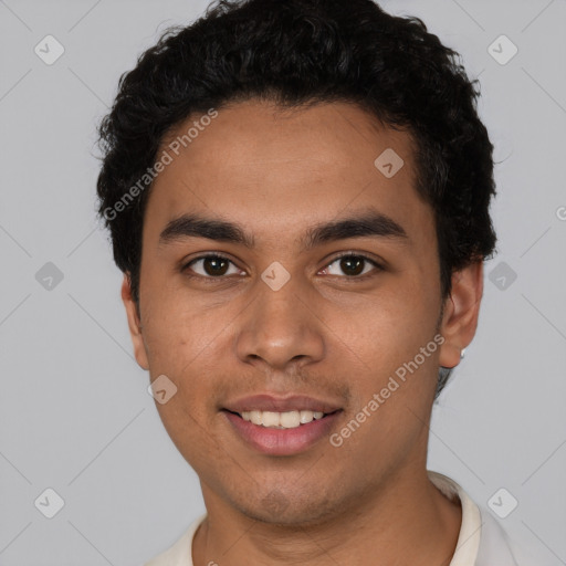 Joyful latino young-adult male with short  brown hair and brown eyes