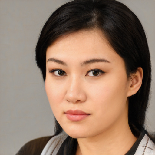 Neutral asian young-adult female with medium  black hair and brown eyes